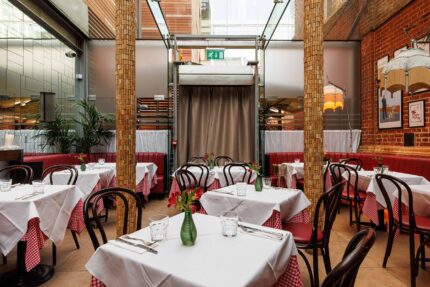 Warm, ambient café lighting welcoming guests inside Galvin Bistrot Bishopsgate.
